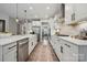 Well-lit kitchen featuring stainless steel appliances, long counters, and a view into the dining area at 1082 Dorsey Dr, Fort Mill, SC 29715