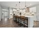 Bright, modern kitchen with a large island, stainless steel appliances, and stylish pendant lighting at 1082 Dorsey Dr, Fort Mill, SC 29715