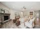 Bright living room showcases a stone fireplace, modern furniture, and wood-look floors, creating an inviting space at 1082 Dorsey Dr, Fort Mill, SC 29715