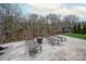 Patio featuring lounge chairs and wooded view with metal fence and trees at 1082 Dorsey Dr, Fort Mill, SC 29715