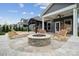 Backyard patio with fire pit, pergola, lounge chairs, and outdoor seating, ideal for relaxation and entertaining guests at 1082 Dorsey Dr, Fort Mill, SC 29715