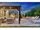 Gorgeous patio with comfortable seating, a cozy fire pit, and charming string lights for evening relaxation at 1082 Dorsey Dr, Fort Mill, SC 29715