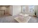 The playroom features a white table, comfortable seating, and carpet flooring at 1082 Dorsey Dr, Fort Mill, SC 29715