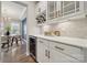 Stylish wet bar area featuring a wine refrigerator, elegant countertops, and custom cabinetry at 1082 Dorsey Dr, Fort Mill, SC 29715