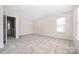 Empty bedroom featuring neutral carpet, paint and ample natural light at 11029 Ardglass Ct, Charlotte, NC 28213