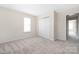A bright bedroom with carpet and a closet offering storage space at 11029 Ardglass Ct, Charlotte, NC 28213