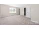 Spacious bedroom with neutral carpet, offering a calm and inviting atmosphere at 11029 Ardglass Ct, Charlotte, NC 28213