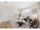 Bright living room with a large window, neutral walls, and modern decor creates a cozy atmosphere at 11029 Ardglass Ct, Charlotte, NC 28213