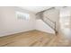 Inviting living room with beautiful laminate floors and a staircase at 11029 Ardglass Ct, Charlotte, NC 28213