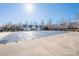 Community pool covered, surrounded by trees and residential buildings under a clear blue sky at 11029 Ardglass Ct, Charlotte, NC 28213