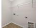 A utilitarian room with connections, offering practical storage solutions at 11029 Ardglass Ct, Charlotte, NC 28213
