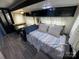Cozy living area featuring stylish decor, ample seating, and wood look flooring at 114 Dove Ln, New London, NC 28127
