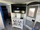 Living area featuring a flat screen tv and a modern cabinet with glass door accents at 114 Dove Ln, New London, NC 28127