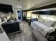 Wide open living area with kitchen, dining area, and main bed at 114 Dove Ln, New London, NC 28127