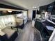 Open-concept living area featuring a dinette, kitchen and bed at 114 Dove Ln, New London, NC 28127