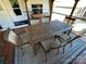 Outdoor patio features a spacious dining table with seating, perfect for entertaining at 114 Dove Ln, New London, NC 28127