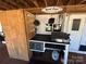 Covered outdoor kitchen equipped with a griddle and cooking appliances for outdoor meals at 114 Dove Ln, New London, NC 28127