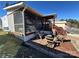 Cozy outdoor patio with lounge chairs, adjacent to the recreational vehicle and stairs at 114 Dove Ln, New London, NC 28127