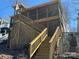 Wood deck and porch showcasing wood lattice around the bottom and wooden steps at 117 Badin Lake Cir, New London, NC 28127