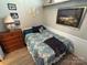 Bedroom featuring wood-look floors, a twin bed, and a wooden dresser at 117 Badin Lake Cir, New London, NC 28127