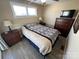 Comfortable bedroom featuring a full bed, complemented by matching nightstands and dresser providing both style and functionality at 117 Badin Lake Cir, New London, NC 28127