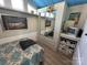 Bedroom featuring a closet with mirrored doors and a vintage television at 117 Badin Lake Cir, New London, NC 28127