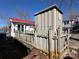 Charming lake house with a bright red roof, offering a cozy and inviting appeal at 117 Badin Lake Cir, New London, NC 28127