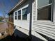 Exterior view of lakeside home featuring white siding and view of the lake at 117 Badin Lake Cir, New London, NC 28127