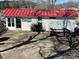 Charming exterior view of home with bright red roof and boat trailer, perfect for lakeside living at 117 Badin Lake Cir, New London, NC 28127