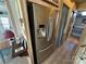 Modern stainless steel refrigerator in a well-lit kitchen area, showcases the sleek appliances and functional design of the space at 117 Badin Lake Cir, New London, NC 28127