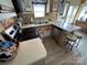 Kitchen featuring laminate counters, stainless steel appliances and bar stool seating at 117 Badin Lake Cir, New London, NC 28127