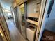 Efficient laundry closet with stacked washer and dryer, set within an accessible location with seamless integration of laundry amenities at 117 Badin Lake Cir, New London, NC 28127