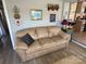 Relaxing living room features a comfortable sofa, decorative wall art, and a stylish accent table at 117 Badin Lake Cir, New London, NC 28127