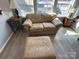 Cozy living room featuring plush seating, a stylish side table, and an inviting ottoman at 117 Badin Lake Cir, New London, NC 28127