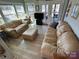 Inviting living room with natural light, comfortable furnishings, and a view of the water at 117 Badin Lake Cir, New London, NC 28127
