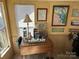 Cozy office space with an array of decorative nautical pieces and maps that create an inspirational and comfortable workspace at 117 Badin Lake Cir, New London, NC 28127