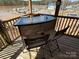 Outdoor bar area with seating, perfect for enjoying refreshments and the picturesque views of the lake at 117 Badin Lake Cir, New London, NC 28127
