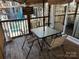 Inviting outdoor dining area with a glass top table and comfortable seating, perfect for enjoying outdoor meals at 117 Badin Lake Cir, New London, NC 28127