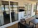 Relaxing outdoor patio featuring comfortable seating, scenic views, and a mounted tv for entertainment at 117 Badin Lake Cir, New London, NC 28127