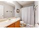 Bathroom featuring a single sink, wooden cabinets, and a shower with a neutral-colored curtain at 1362 Copper Creek Ln, Fort Mill, SC 29715
