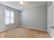 Bedroom featuring neutral carpet and natural light from a window with white shutters at 1362 Copper Creek Ln, Fort Mill, SC 29715
