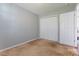 Bedroom featuring neutral carpet, light grey walls, and a spacious closet at 1362 Copper Creek Ln, Fort Mill, SC 29715