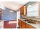 Eat-in kitchen offers wood cabinets, stainless sink and sliding doors to the exterior at 1362 Copper Creek Ln, Fort Mill, SC 29715