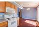 Eat-in kitchen offers wood cabinets, stainless appliances and hardwood floors at 1362 Copper Creek Ln, Fort Mill, SC 29715