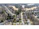 Aerial view of the neighborhood with tree-lined streets, golf course, and picturesque landscaping at 16032 Hollingbourne Rd, Huntersville, NC 28078
