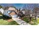 Charming two-story home features a brick facade, attached garage, and mature landscaping at 16032 Hollingbourne Rd, Huntersville, NC 28078