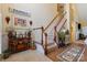 Welcoming foyer features hardwood floors, staircase, and stylish decor, offering a warm ambiance at 16032 Hollingbourne Rd, Huntersville, NC 28078