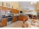 Modern kitchen with stainless steel appliances and plenty of natural light, flowing into the living area at 16032 Hollingbourne Rd, Huntersville, NC 28078