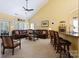 Spacious living area featuring vaulted ceilings, comfortable seating, and ample natural light from sliding glass doors at 16032 Hollingbourne Rd, Huntersville, NC 28078