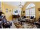 Elegant living room with vaulted ceilings, a large window, and classic decor at 16032 Hollingbourne Rd, Huntersville, NC 28078